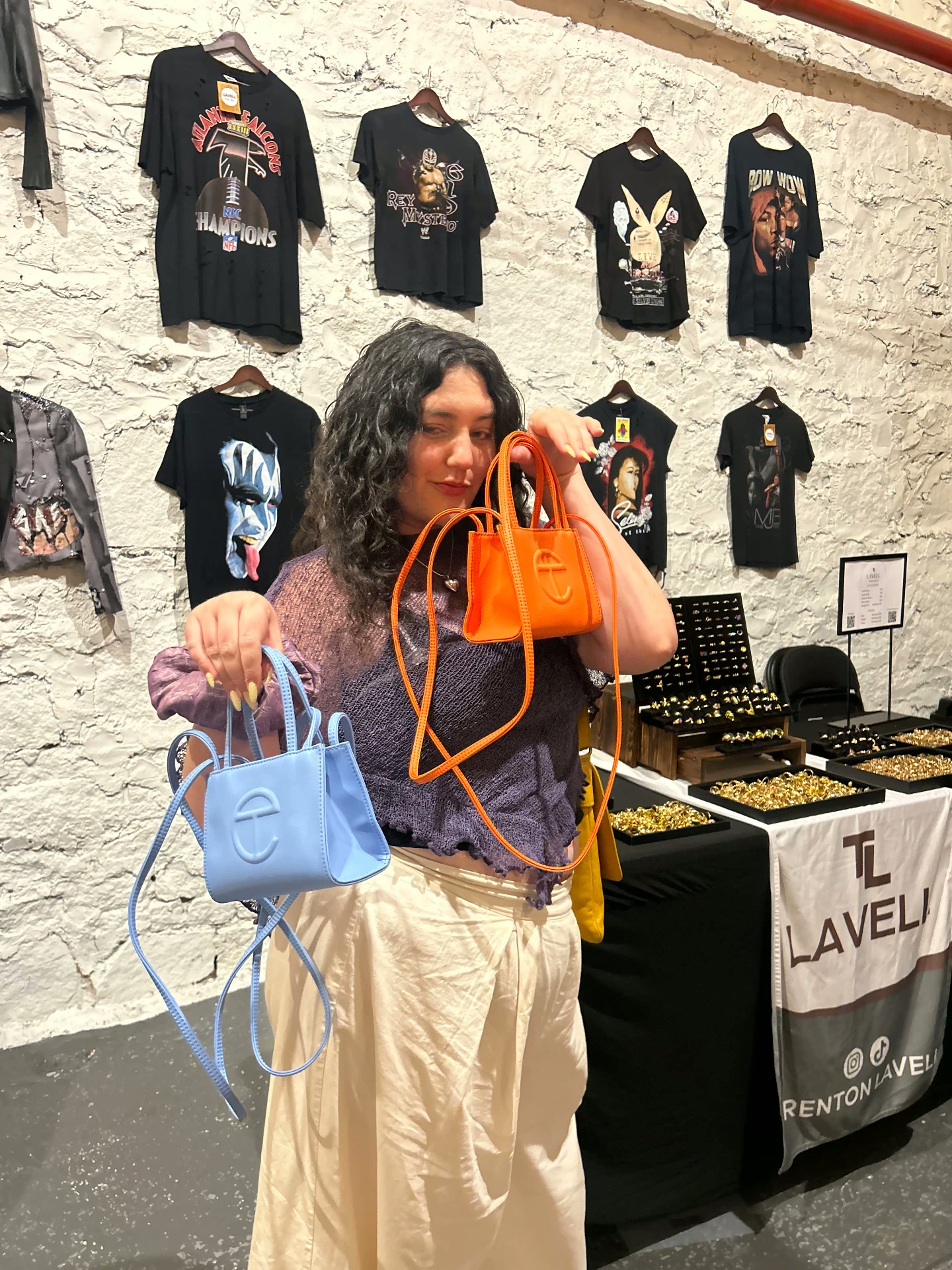 Guest showing colorful handbags