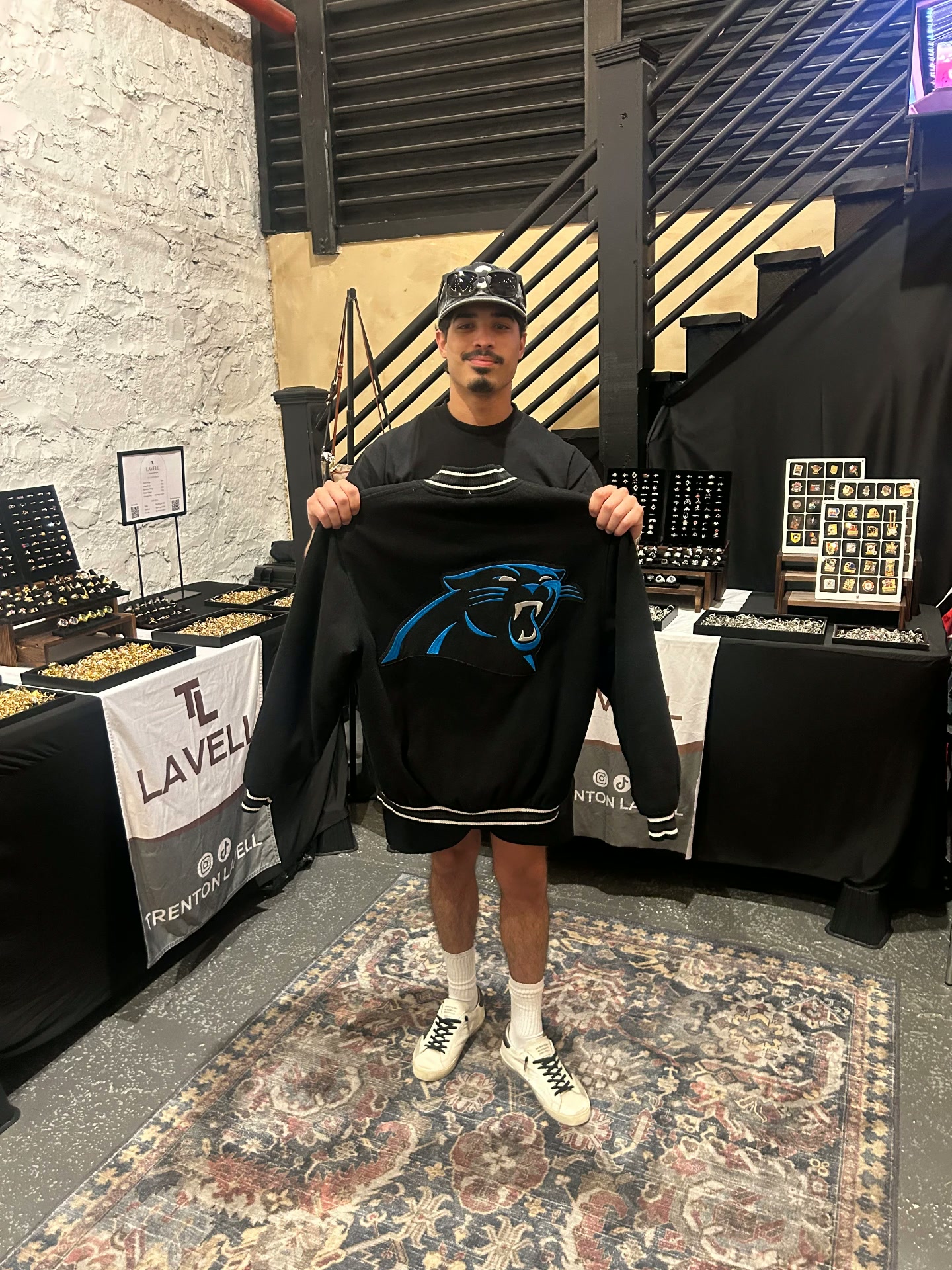 Lavell vendor holding a Panthers jersey